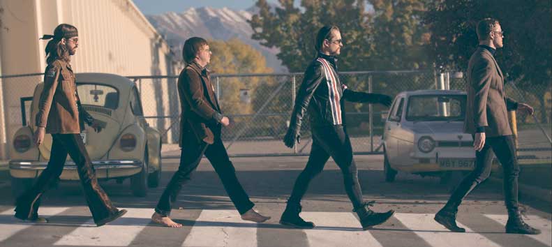 Image of Imagine Dragons band members replicatng the Beatles walking across Abbey Road